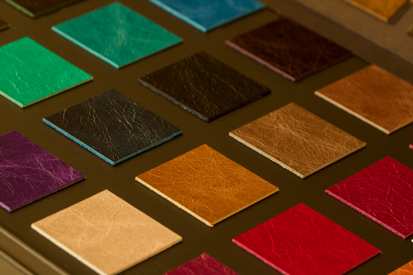 Colorful leather samples on dark background, choice of texture and color